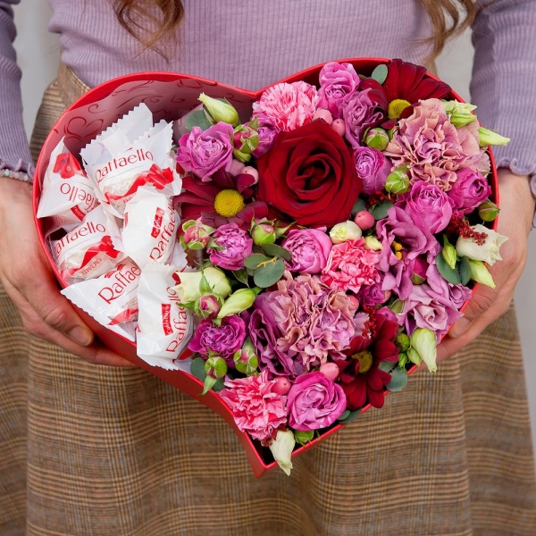 Red rose 50 cm - 3, Bright pink spray rose mix, 50 cm - 3, Pink carnation - 3, Pink spray carnation - 3, Pink Lisianthus (Eustoma) - 2, Bacardi Red Spray Chrysanthemum - 3, Heart‑shaped box for arrangements, Oasis, Film, Box of candies «Raffaello» 150 g, Hypericum, Eucalyptus Cinerea