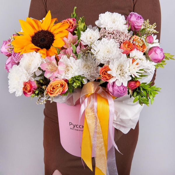 Sunflower - 1, Alstromeria white, soft pink - 5, Bright pink spray rose mix, 50 cm - 2, Baltica White Spray Chrysanthemum - 2, Spray rose: yellow, orange 50 cm - 3, Round flower box small , Oasis, Ozotamnus, Pistachio, Limonium (1 pc.), Wrapping Paper