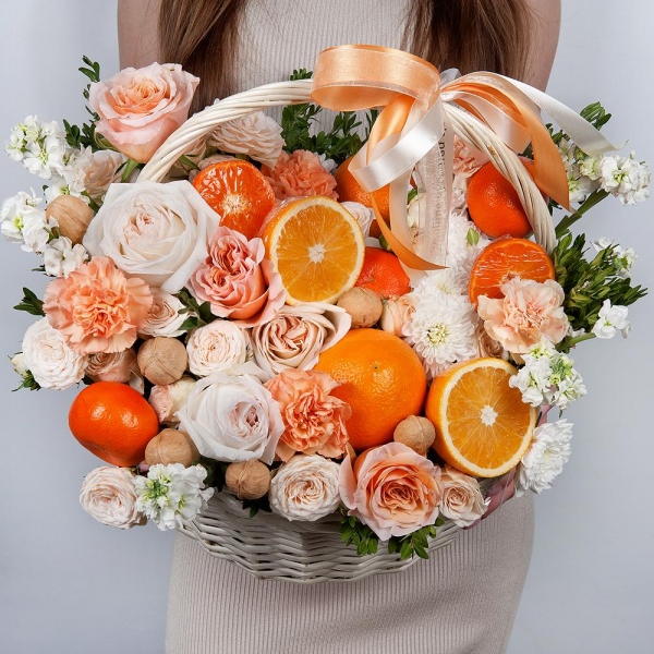 Cream Rose 50 cm Ecuador (Creme Caramel) - 3, Peony style roses - 3, Orange carnation - 8, White Matthiola - 5, Baltica White Spray Chrysanthemum - 2, Peony sprayrose - 3, Carnation white, cream - 9, Large Basket, Oasis, Pistachio, Orange, Tangerine, 1 pc., Walnut (10 pieces), Wooden skewer, Ribbon, Walnut (10 pieces)