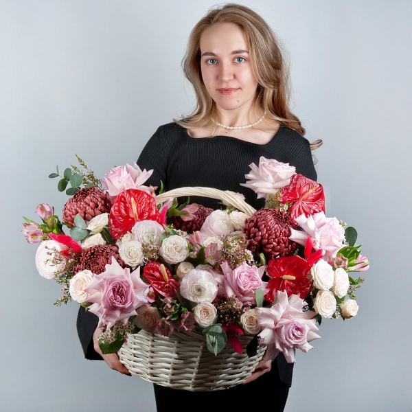 Red cut anthurium - 4, Chrysanthemum Bigoudi purple - 4, Peony style roses - 7, Ranunculus Pink - 5, Alstromeria white, soft pink - 11, Peony sprayrose - 5, Medium Basket, Oasis, Waxflower (1 pc.), Eucalyptus, Dried flowers in assortment
