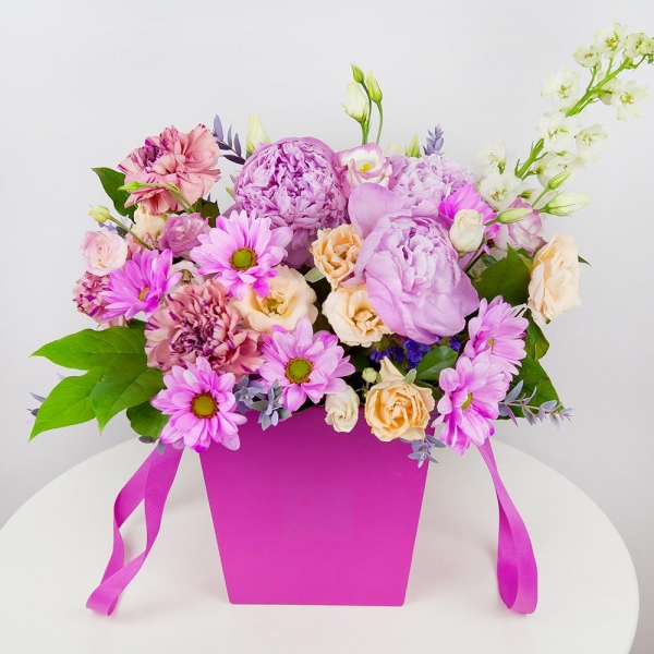 White Delphinium - 2, Spray rose: white, cream, light pink 50 cm - 6, Pink carnation - 5, Pink Lisianthus (Eustoma) - 5, Peony pink - 4, Bacardi Pink Spray Chrysanthemum - 2, Round flower box small , Oasis, Salal, Eucalyptus parvifolia (1 pc.)
