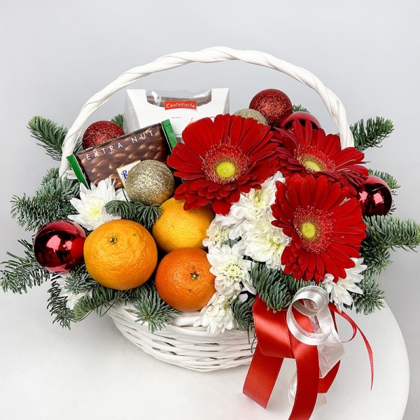 Gerbera red - 3, Baltica White Spray Chrysanthemum - 3, Medium Basket, Oasis, Spruce branches (1pc.), Tangerine, 1 pc., Chocolate Ritter Sport 100g, Box of candies «Raffaello» 150 g, Ribbon, Christmas decor (set)