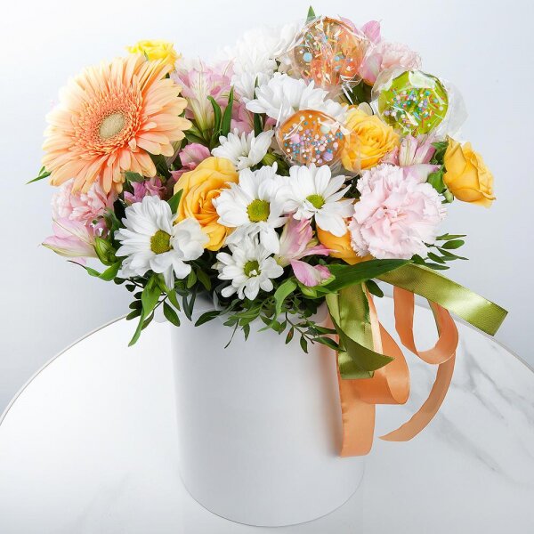 Gerbera yellow - 1, Pink carnation - 3, Alstromeria white, soft pink - 2, Bacardi White Spray Chrysanthemum - 1, Spray rose: yellow, orange 50 cm - 1, Round flower box small , Ribbon, Oasis, Pistachio, Topper (for flowers)