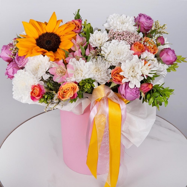 Sunflower - 1, Alstromeria white, soft pink - 5, Bright pink spray rose mix, 50 cm - 2, Baltica White Spray Chrysanthemum - 2, Spray rose: yellow, orange 50 cm - 3, Round flower box small , Oasis, Ozotamnus, Pistachio, Limonium (1 pc.), Wrapping Paper