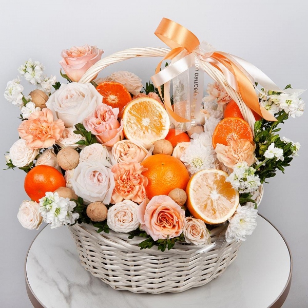 Cream Rose 50 cm Ecuador (Creme Caramel) - 3, Peony style roses - 3, Orange carnation - 5, White Matthiola - 5, Baltica White Spray Chrysanthemum - 2, Peony sprayrose - 3, Carnation white, cream - 6, Large Basket, Oasis, Pistachio, Orange, Tangerine, 1 pc., Walnut (10 pieces), Wooden skewer, Ribbon, Walnut (10 pieces)