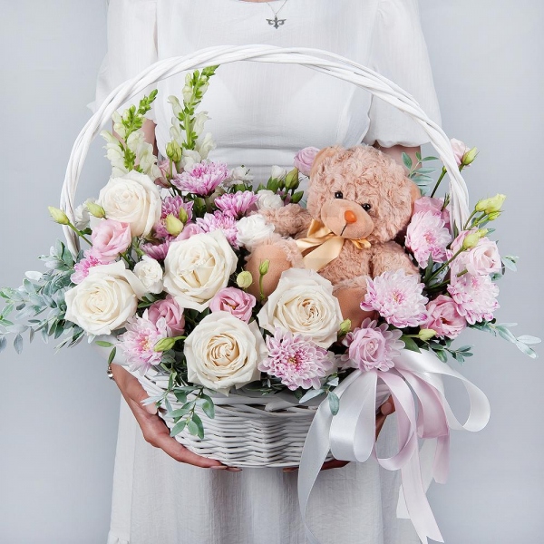 White Matthiola - 2, White rose 50 cm - 7, Baltica Pink Spray Chrysanthemum - 3, White spray carnation - 3, Pink Lisianthus (Eustoma) - 2, Medium Basket, Oasis, Pistachio, Teddy bear 20 cm, Ribbon