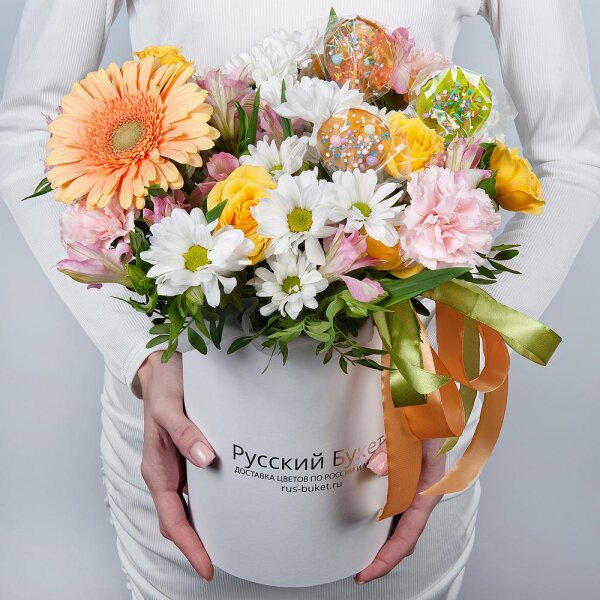 Gerbera yellow - 1, Pink carnation - 3, Alstromeria white, soft pink - 2, Bacardi White Spray Chrysanthemum - 1, Spray rose: yellow, orange 50 cm - 1, Round flower box small , Ribbon, Oasis, Pistachio, Topper (for flowers)