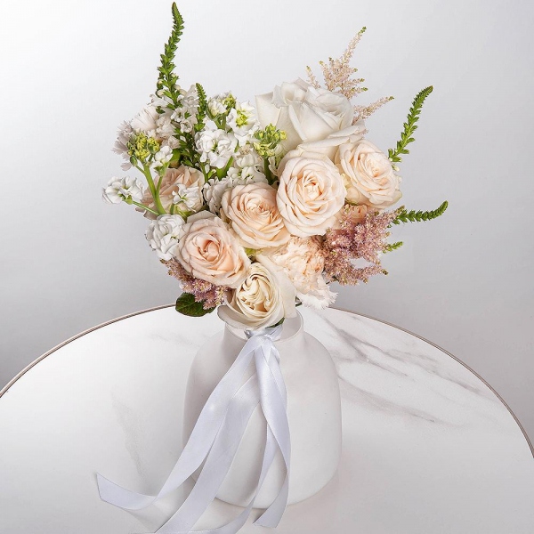 White rose 50 cm Ecuador - 3, Peony sprayrose - 2, White Matthiola - 3, Carnation white, cream - 7, Veronica spray, Astilbe, Ribbon