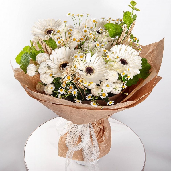 Gerbera white - 9, Chamomile - 3, Newton White Spray Chrysanthemum - 4, Dried flowers in assortment,  Raspberry branch, Wrapping Paper