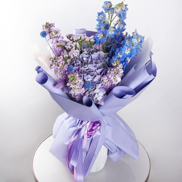 Blue/purple hydrangea - 1, Matthiola Lilac - 7, Blue Delphinium, Dried flowers in assortment, Craspedia, Blue Statice, Wrapping Paper