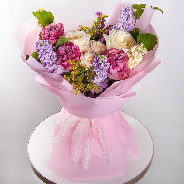 White rose 50 cm Ecuador - 7, Pink rose Country Blues 50 cm - 3, Spray rose: white, cream, light pink 50 cm - 5, Matthiola Lilac - 4, White Matthiola - 3, Pink Statice, Solidago (1 pc.),  Raspberry branch, Wrapping Paper
