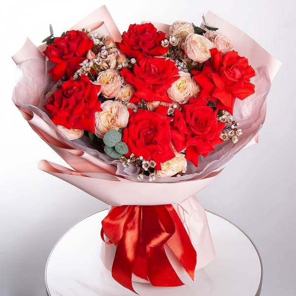 Red rose Nina 50 cm - 7, Spray rose: white, cream, light pink 50 cm - 5, Waxflower (1 pc.), Wrapping Paper, Eucalyptus