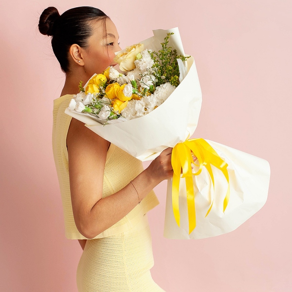 Spray rose: yellow, orange 50 cm - 2, lisianthus - 3, Carnation white, cream - 3, White spray carnation - 3, Rose Yellow 50 cm Ecuador (Mohana, Latina, Brighton) - 1, Solidago (1 pc.), Limonium (1 pc.), Wrapping Paper