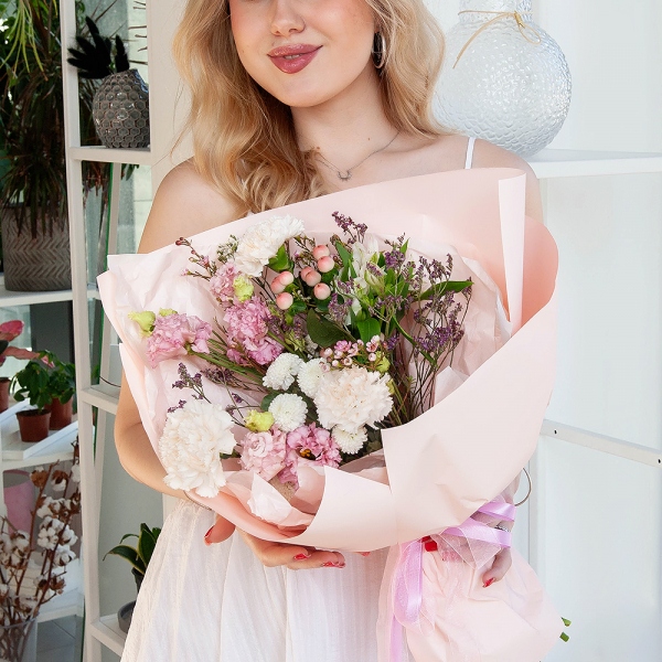 Carnation white, cream - 5, Newton White Spray Chrysanthemum - 1, Alstromeria white, soft pink - 1, Pink Lisianthus (Eustoma) - 2, Hypericum, Limonium (1 pc.), Waxflower (1 pc.), Wrapping Paper