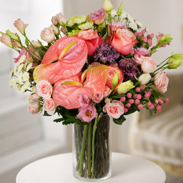 Pink Lisianthus (Eustoma) - 3, Athos poms Stallion - 3, Lilac carnation - 2, Bright pink spray rose mix, 50 cm - 6, Pink cut anthurium - 2, Peony rose Kahala 50 cm - 3, Hypericum, Aspidistra (1 pc.), Wrapping Paper