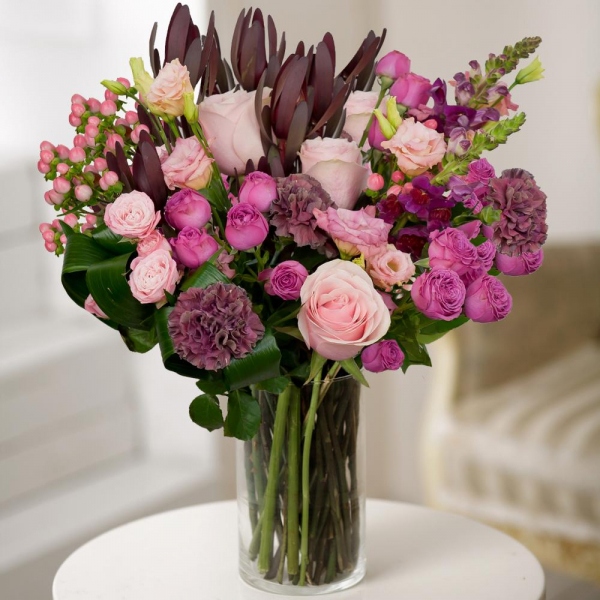 Pink Lisianthus (Eustoma) - 1, Matthiola Lilac - 2, Bright pink spray rose mix, 50 cm - 4, Pink rose 50 cm - 3, Lilac carnation - 3, Leukodendron, Hypericum, Aspidistra (1 pc.), Wrapping Paper