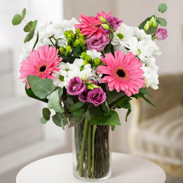 Gerbera pink - 3, Bacardi White Spray Chrysanthemum - 3, Purple Lisianthus (Eustoma) - 2, Hypericum, Eucalyptus Cinerea, Wrapping Paper