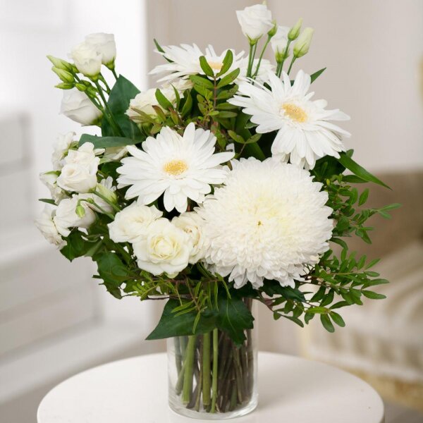 Magnum White Chrysanthemum - 2, Gerbera white - 4, lisianthus - 2, Spray rose: white, cream, light pink 50 cm - 4, Pistachio, Aspidistra (1 pc.), Wrapping Paper