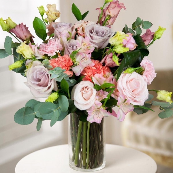 Orange carnation - 2, Pink rose 50 cm - 6, Alstromeria white, soft pink - 2, Pink Lisianthus (Eustoma) - 3, Pink carnation - 2, Ruscus, Aspidistra (1 pc.), Eucalyptus Cinerea, Wrapping Paper