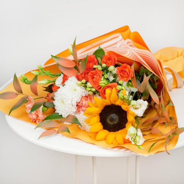 Sunflower - 2, Orange carnation - 3, lisianthus - 4, Baltica White Spray Chrysanthemum - 2, Spray rose: yellow, orange 50 cm - 4, Ruscus italian, Wrapping Paper