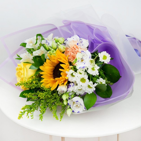 Sunflower - 1, Yellow rose 50 cm - 1, Carnation white, cream - 1, Santini White Spray Chrysanthemum - 1, Alstromeria white, soft pink - 1, lisianthus - 2, Solidago (1 pc.), Ruscus, Ribbon, Wrapping Paper