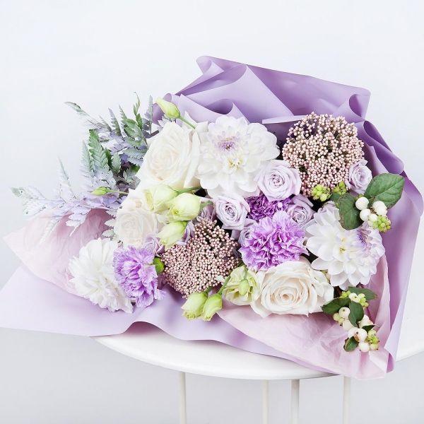 White rose 50 cm - 3, White Dahlia - 3, Lilac carnation - 3, Spray rose: white, cream, light pink 50 cm - 2, lisianthus - 2, Ozotamnus, Fern (1 pc.), Wrapping Paper, Symphoricarpos