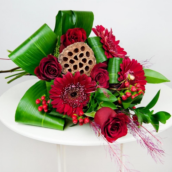 Red rose 50 cm - 9, Gerbera red - 6, Ruscus, Aspidistra (1 pc.), Hypericum, Dried flowers decor, Skimmia, Ribbon