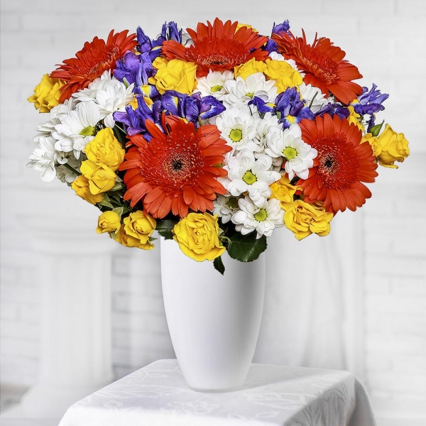 Spray rose: yellow, orange 50 cm - 15, Bacardi White Spray Chrysanthemum - 9, Gerbera daisies - 9, Irises - 15, Jute 1 meter, Ribbon
