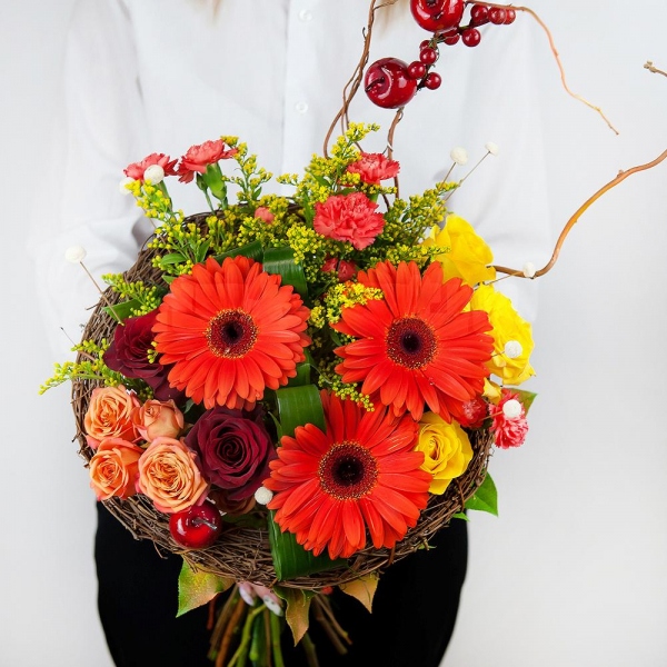 Red rose 50 cm - 4, Yellow rose 50 cm - 5, Gerbera daisies - 4, Pink spray carnation - 5, Spray rose: yellow, orange 50 cm - 2, The frame of the branches, Aspidistra (1 pc.), Solidago (1 pc.), Salal, Dried flowers decor, Artificial branch, Decorative element small, Ribbon