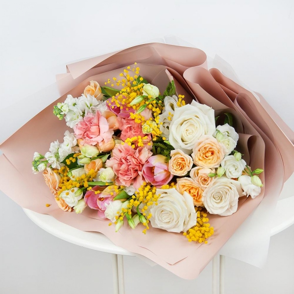 Spray rose: white, cream, light pink 50 cm - 4, White rose 50 cm - 5, Pink carnation - 4, lisianthus - 3, Pink tulip - 5, Mimosa - 2, White Matthiola - 3, Wrapping Paper