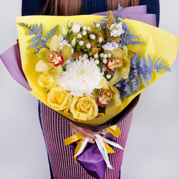 Magnum White Chrysanthemum - 1, Orchid bud yellow/brown Cymbidium - 3, Purple Lisianthus (Eustoma) - 2, Yellow rose 50 cm - 3, Flask for orchids, Hypericum, Solidago (1 pc.), Fern (1 pc.), Wrapping Paper