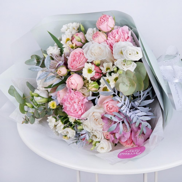 Santini White Spray Chrysanthemum - 4, Alstromeria white, soft pink - 3, Pink carnation - 3, White rose 50 cm - 5, Peony sprayrose - 4, lisianthus - 4, Pistachio, Eucalyptus Cinerea, Wrapping Paper