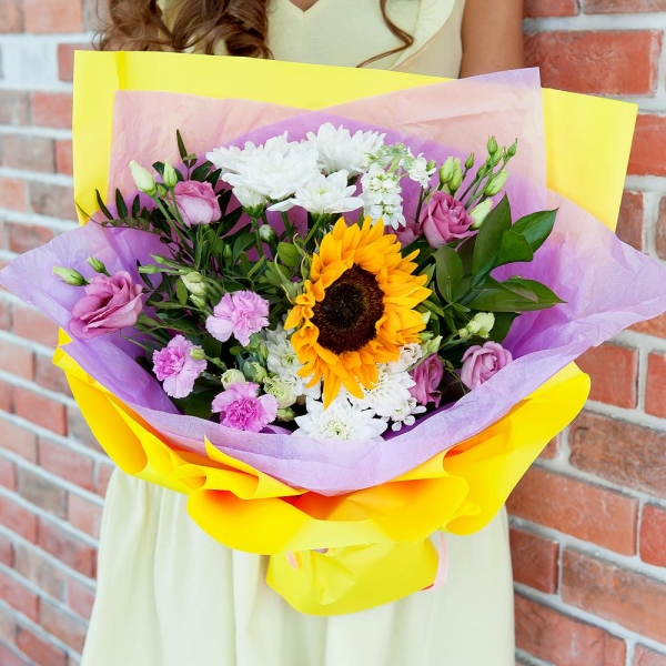 Baltica White Spray Chrysanthemum - 2, Pink Lisianthus (Eustoma) - 3, Pink spray carnation - 2, Sunflower - 1, White Matthiola - 1, Pistachio, Ruscus, Wrapping Paper