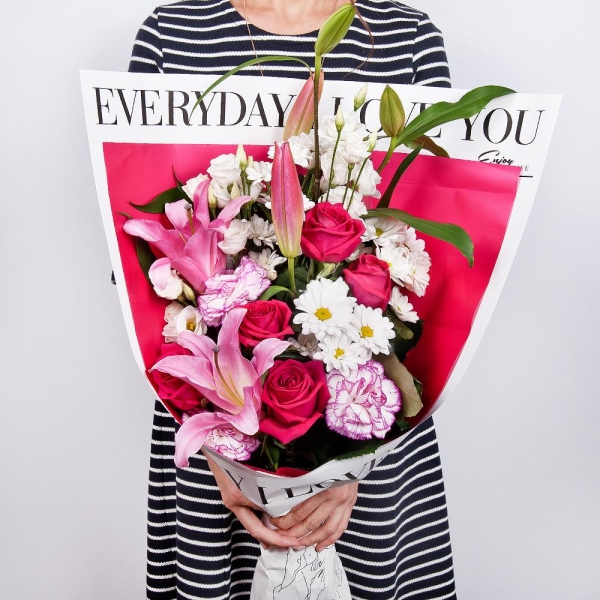 Pink lily - 2, Bacardi White Spray Chrysanthemum - 3, lisianthus - 2, Pink rose 50 cm - 9, Pink carnation - 3, Wrapping Paper