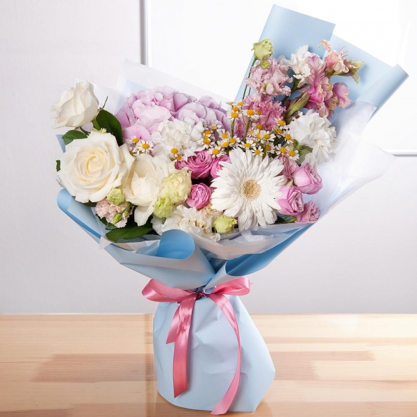 Gerbera white - 1, Pink Hydrangea - 1, Carnation white, cream - 3, Chamomile - 2, Peony sprayrose - 2, White rose 50 cm - 3, Pink Gladiolus - 1, lisianthus - 1, Pink Lisianthus (Eustoma) - 1, Wrapping Paper