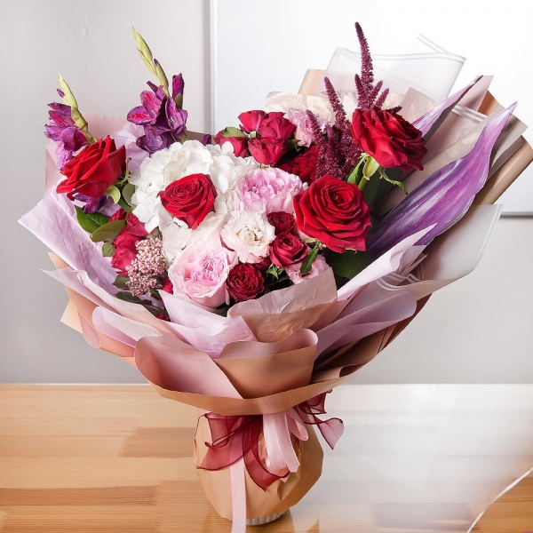  White Hydrangea - 1, Red rose 50 cm - 9, Peony rose pink 'OHara' - 2, Pink Gladiolus - 3, Spray rose: red 50 cm - 4, Pink Lisianthus (Eustoma) - 4, Eucalyptus Cinerea, Celosia, Ozotamnus, Aspidistra (1 pc.), Wrapping Paper