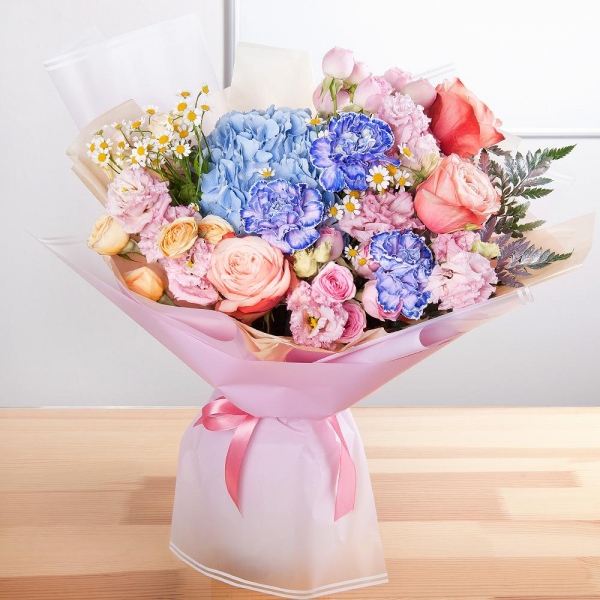 Blue/purple hydrangea - 1, Lilac carnation - 7, Peony rose Kahala 50 cm - 5, Spray rose: white, cream, light pink 50 cm - 6, Chamomile - 2, Pink Lisianthus (Eustoma) - 3, Fern (1 pc.), Wrapping Paper