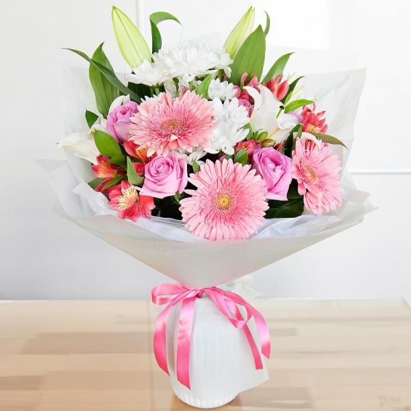 Lilies - 2, Alstromeria Red, Bright Pink - 4, Gerbera pink - 4, Pink rose 50 cm - 9, Bacardi White Spray Chrysanthemum - 4, Pistachio, Ruscus, Wrapping Paper, Ribbon