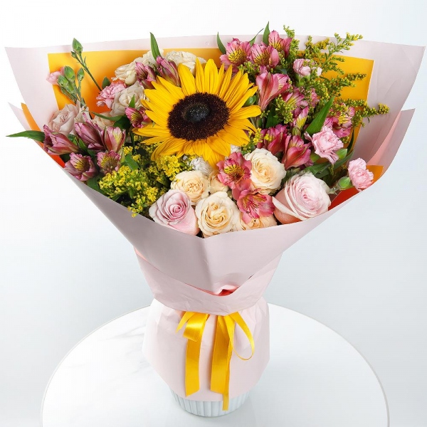 Sunflower - 1, Spray rose: white, cream, light pink 50 cm - 3, Pink rose 50 cm - 5, Pink spray carnation - 6, Alstromeria Red, Bright Pink - 6, Baltica White Spray Chrysanthemum - 1, Solidago (1 pc.), Wrapping Paper