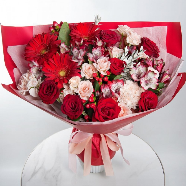Gerbera red - 3, Red rose 50 cm - 9, Spray rose: white, cream, light pink 50 cm - 4, Alstromeria Red, Bright Pink - 6, Carnation white, cream - 5, Hypericum, Pistachio, Wrapping Paper