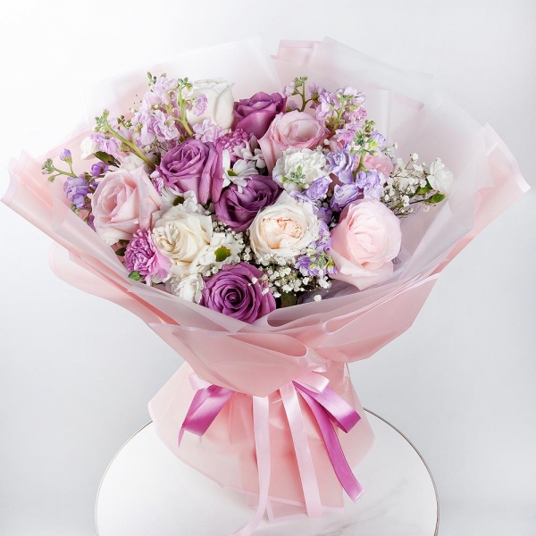 Bacardi White Spray Chrysanthemum - 2, Gypsophila - 2, Matthiola Lilac - 4, Pink rose 50 cm - 4, Moody Blue Rose - 4, Peony style roses - 3, Pink carnation - 2, White spray carnation - 2, Wrapping Paper