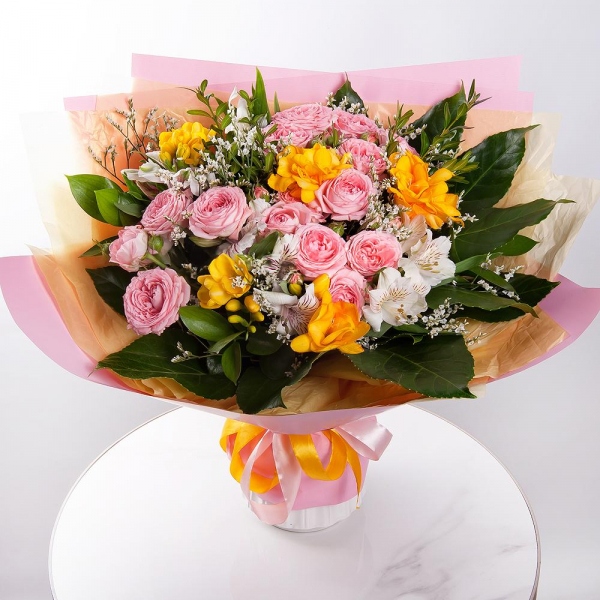 Bright pink spray rose mix, 50 cm - 3, Freesia - 5, Alstromeria white, soft pink - 6, Limonium (1 pc.), Pistachio, Fatsia (1 pc.), Wrapping Paper