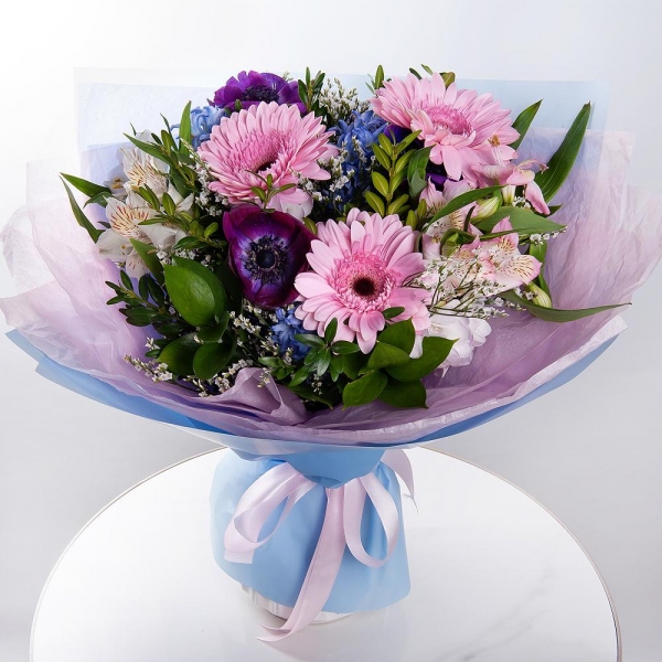 Gerbera pink - 3, Blue anemone - 4, Blue Hyacinth - 4, Alstromeria white, soft pink - 4, Freesia - 2, Limonium (1 pc.), Pistachio, Ruscus, Wrapping Paper