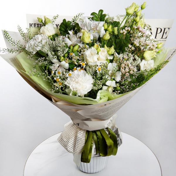 Carnation white, cream - 3, lisianthus - 2, Alstromeria white, soft pink - 3, Chamomile - 2, Pistachio, Veronica spray, Green bell (1 pc.), Waxflower (1 pc.), Limonium (1 pc.), Wrapping Paper