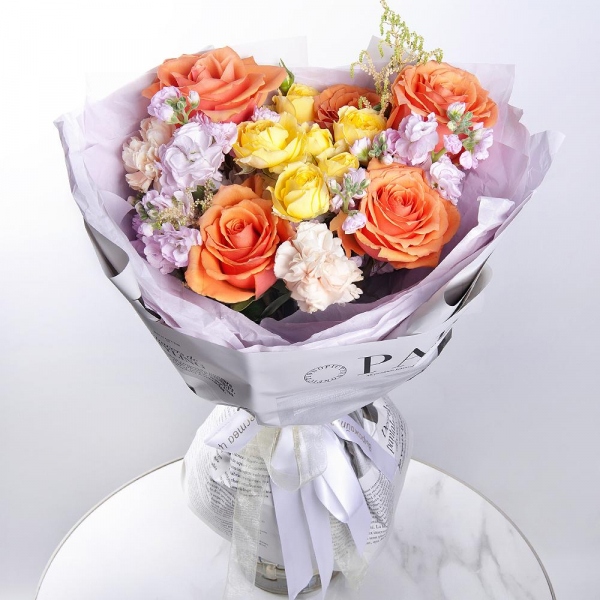 Rose Ecuador 50 cm - 5, Spray rose: yellow, orange 50 cm - 1, Baltica White Spray Chrysanthemum - 1, Carnation white, cream - 2, Matthiola Lilac - 2, Astilbe, Wrapping Paper