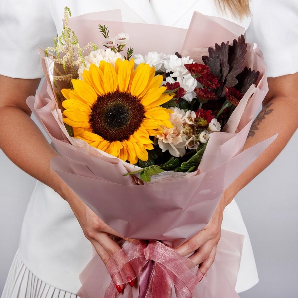 Sunflower - 1, Pink carnation - 4, Bacardi White Spray Chrysanthemum - 1, Bacardi Red Spray Chrysanthemum - 1, Astilbe, Waxflower (1 pc.), Pistachio, Salal, Wrapping Paper