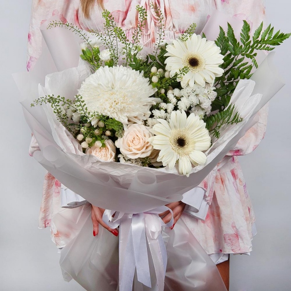 Gerbera white - 4, Magnum White Chrysanthemum - 1, Peony sprayrose - 2, White spray carnation - 3, White Matthiola - 2, Hypericum, White statice, Pistachio, Fern (1 pc.), Green bell (1 pc.), Wrapping Paper
