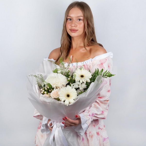 Gerbera white - 4, Magnum White Chrysanthemum - 1, Peony sprayrose - 2, White spray carnation - 3, White Matthiola - 2, Hypericum, White statice, Pistachio, Fern (1 pc.), Green bell (1 pc.), Wrapping Paper